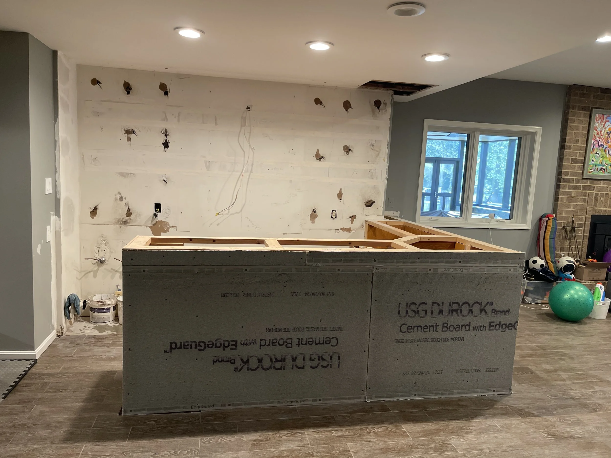 Modern basement bar with slat paneling Potomac MD renovation